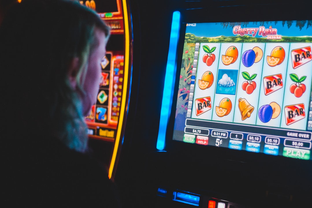 man playing slot machine game man playing slot machine game